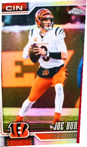 Original Joe Burrow football card, partly concealed behind the foreground cards